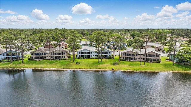 drone / aerial view with a residential view and a water view
