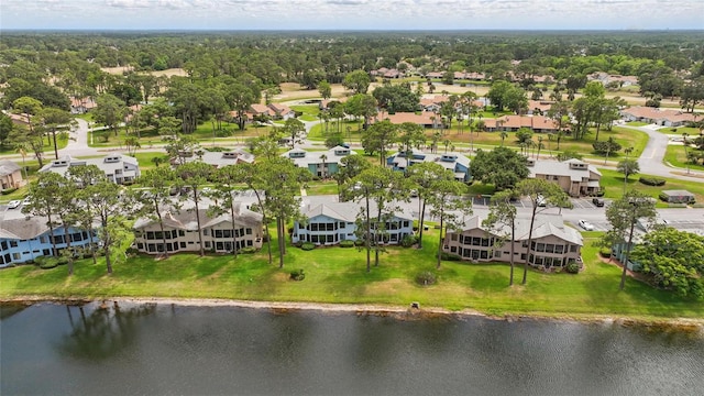 drone / aerial view featuring a water view and a residential view