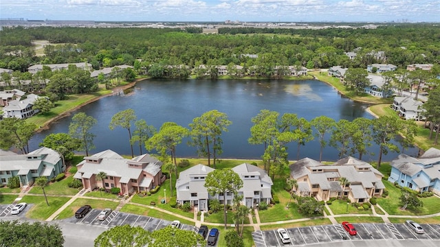 birds eye view of property featuring a water view and a residential view