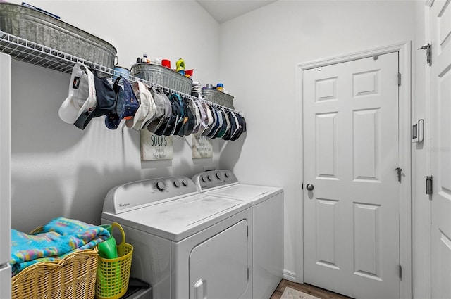 laundry room with light wood-style flooring, laundry area, and independent washer and dryer