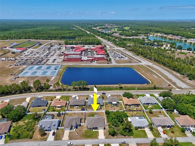 bird's eye view with a water view, a forest view, and a residential view