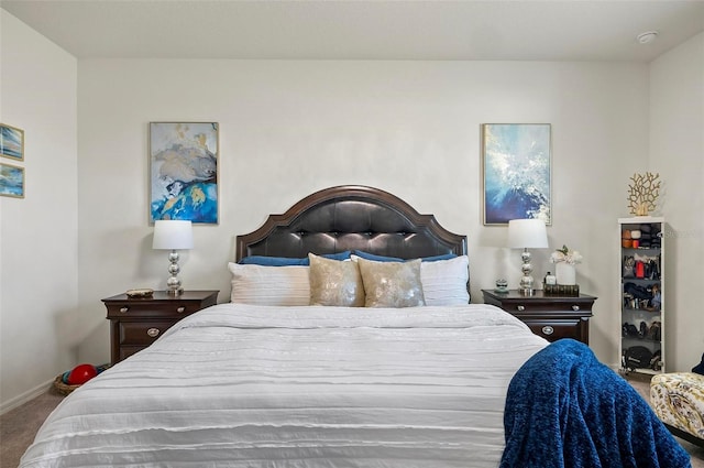 carpeted bedroom featuring baseboards
