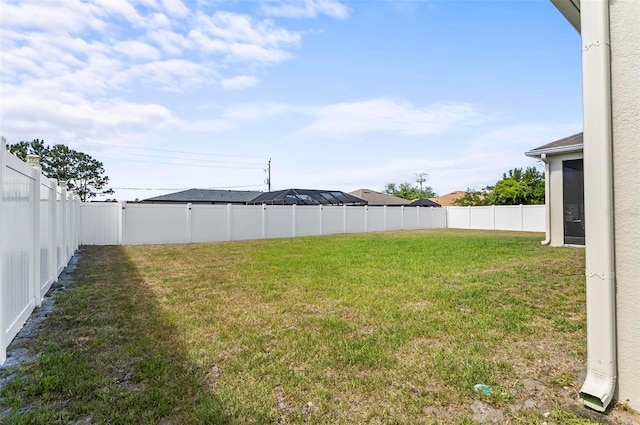 view of yard featuring a fenced backyard