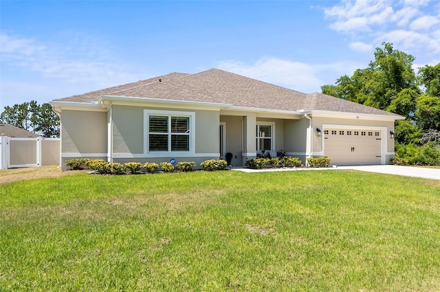 ranch-style home featuring a garage, stucco siding, fence, concrete driveway, and a front lawn