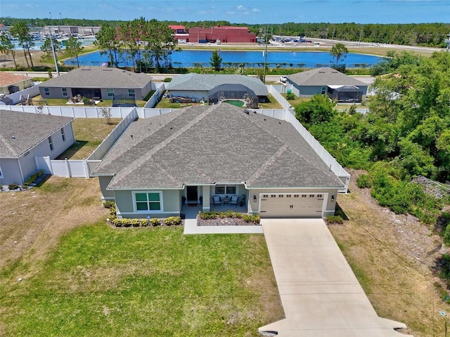 drone / aerial view featuring a water view