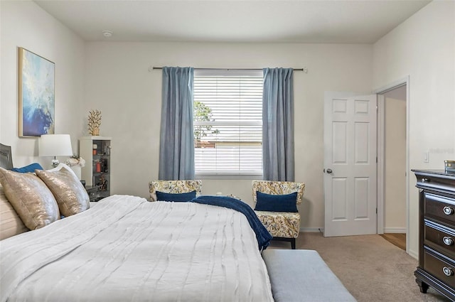 bedroom featuring baseboards and carpet floors