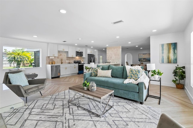 104 Foxhall Ln, Palm Coast, FL 32137 - living room with recessed lighting and baseboards
