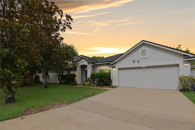 237 N Hidden Tree Dr, Saint Augustine, FL 32086 - ranch-style home with stucco siding, a garage, concrete driveway, and a front lawn