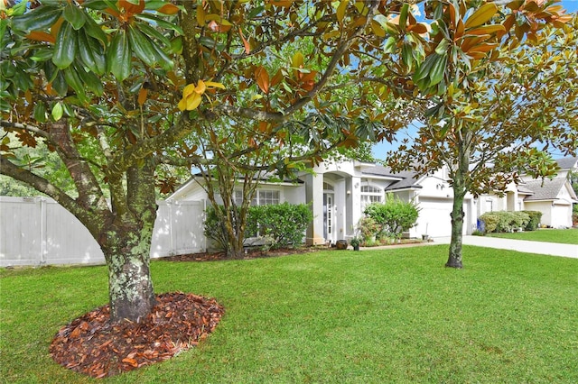 237 N Hidden Tree Dr, Saint Augustine, FL 32086 - view of front of house with an attached garage, concrete driveway, and stucco siding