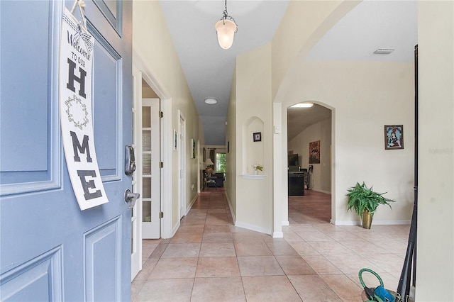 237 N Hidden Tree Dr, Saint Augustine, FL 32086 - foyer entrance featuring arched walkways and light tile patterned floors