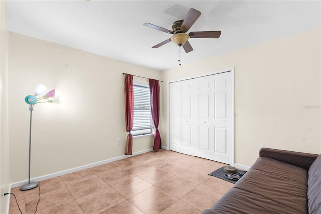 237 N Hidden Tree Dr, Saint Augustine, FL 32086 - bedroom with a closet, a ceiling fan, and light tile patterned floors