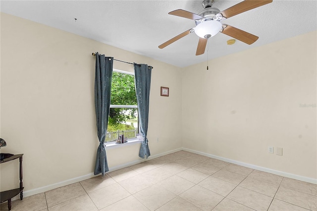 237 N Hidden Tree Dr, Saint Augustine, FL 32086 - unfurnished room with light tile patterned flooring, ceiling fan, and a smoke detector