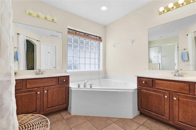 237 N Hidden Tree Dr, Saint Augustine, FL 32086 - bathroom featuring two vanities, a bath, a shower stall, and tile patterned floors