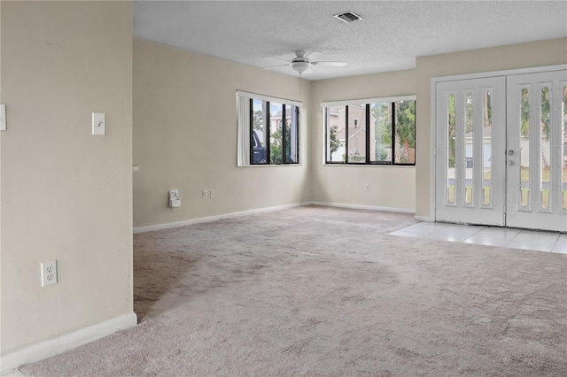 14 Post Oak Ln, Palm Coast, FL 32164 - empty room featuring carpet floors, baseboards, a textured ceiling, and ceiling fan