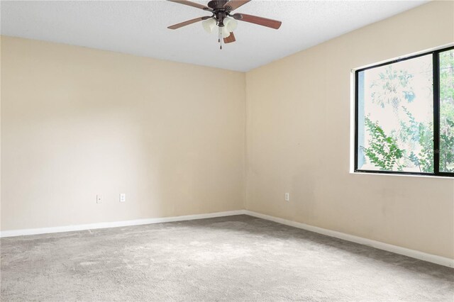 14 Post Oak Ln, Palm Coast, FL 32164 - spare room with carpet, baseboards, and ceiling fan