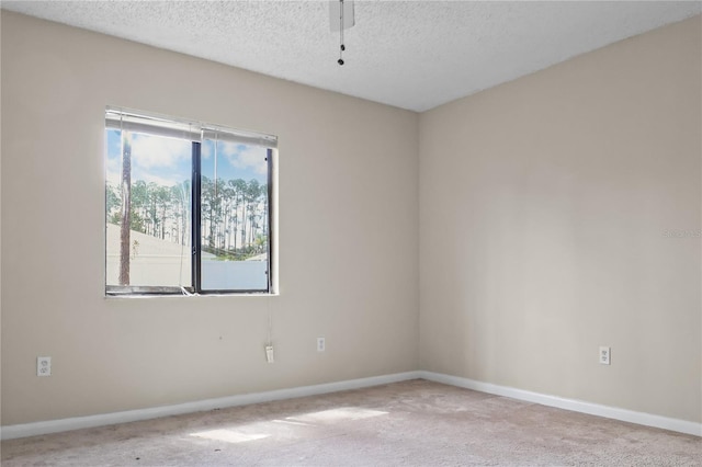 14 Post Oak Ln, Palm Coast, FL 32164 - empty room with carpet flooring, baseboards, a textured ceiling, and a ceiling fan