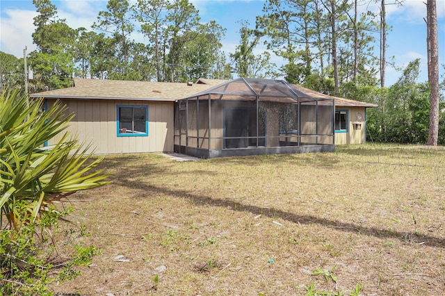 14 Post Oak Ln, Palm Coast, FL 32164 - rear view of property with a lawn and a lanai