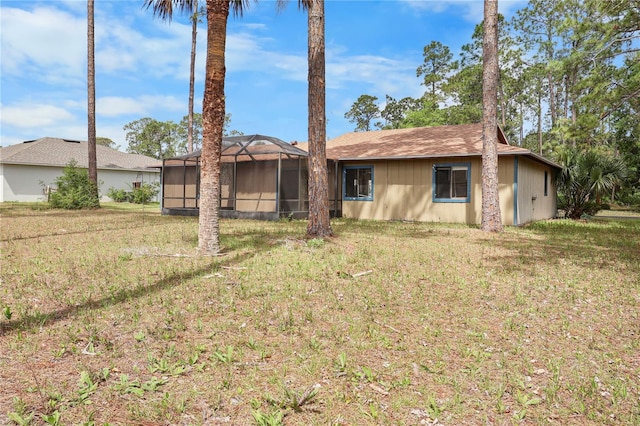 14 Post Oak Ln, Palm Coast, FL 32164 - back of property with a yard and a lanai