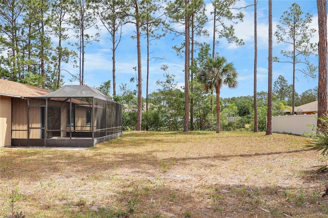 14 Post Oak Ln, Palm Coast, FL 32164 - view of green lawn with glass enclosure
