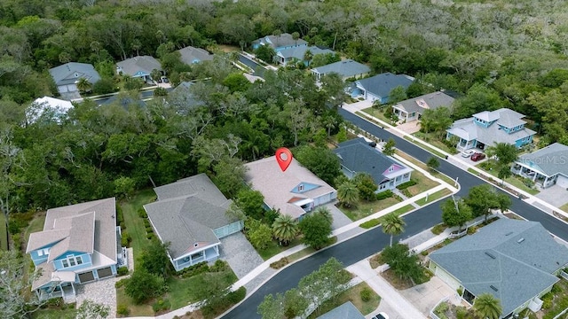 aerial view of property and surrounding area with nearby suburban area