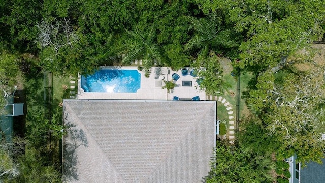 view of subject property with a pool area