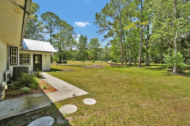 view of yard featuring central AC