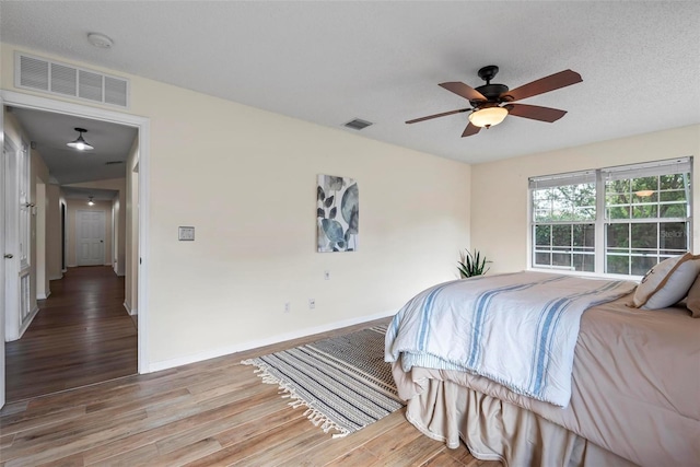 49 Louisiana Dr, Palm Coast, FL 32137 - bedroom featuring wood finished floors, baseboards, and ceiling fan