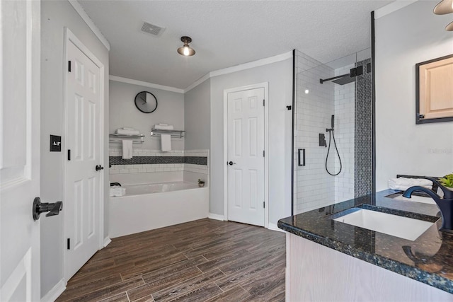 49 Louisiana Dr, Palm Coast, FL 32137 - full bathroom with a sink, a shower stall, wood finished floors, ornamental molding, and a bath
