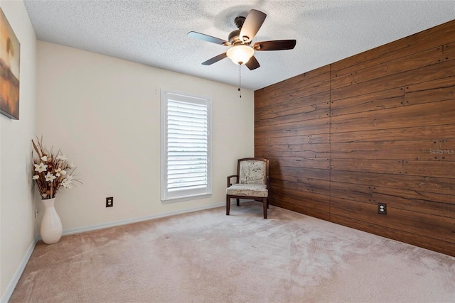 49 Louisiana Dr, Palm Coast, FL 32137 - unfurnished room featuring ceiling fan, carpet flooring, a textured ceiling, baseboards, and wooden walls