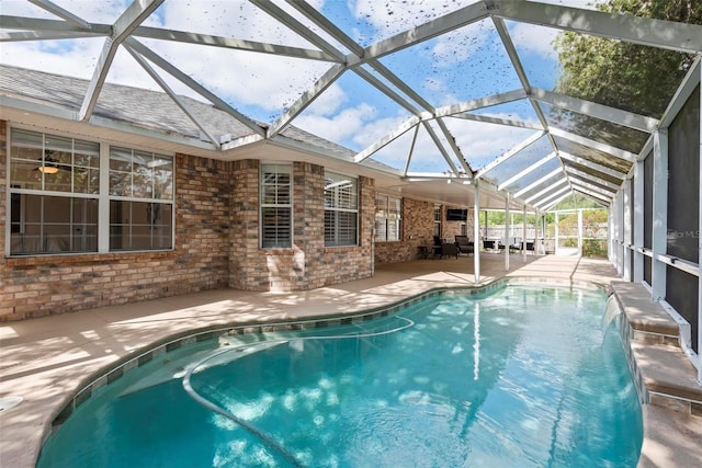 49 Louisiana Dr, Palm Coast, FL 32137 - outdoor pool featuring a patio area and glass enclosure