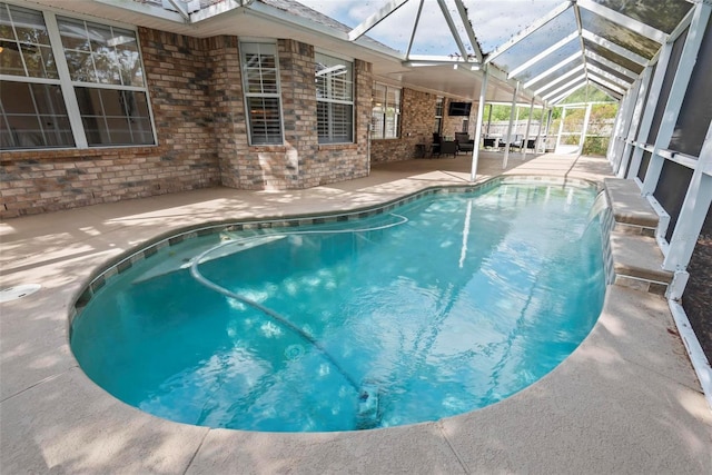 49 Louisiana Dr, Palm Coast, FL 32137 - swimming pool with a patio area and glass enclosure