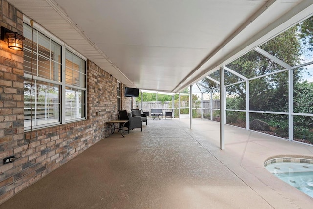 49 Louisiana Dr, Palm Coast, FL 32137 - view of patio / terrace with fence, glass enclosure, and a jacuzzi