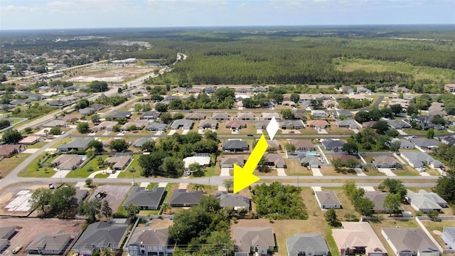 49 Louisiana Dr, Palm Coast, FL 32137 - aerial overview of property's location with a forest and nearby suburban area