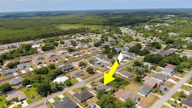 49 Louisiana Dr, Palm Coast, FL 32137 - aerial overview of property's location with a forest and nearby suburban area