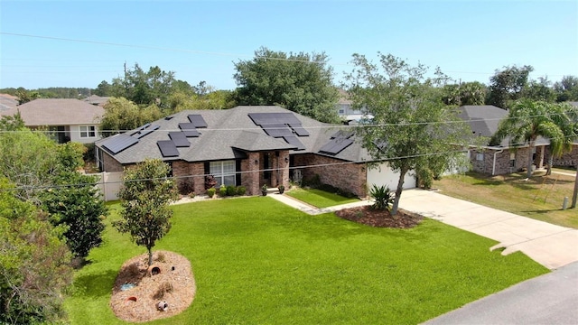 49 Louisiana Dr, Palm Coast, FL 32137 - view of front of home with concrete driveway, roof mounted solar panels, a garage, roof with shingles, and stone siding