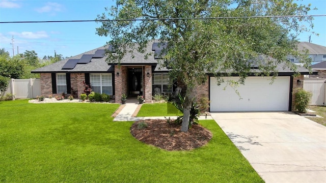 49 Louisiana Dr, Palm Coast, FL 32137 - view of front of property featuring roof mounted solar panels, brick siding, roof with shingles, driveway, and an attached garage