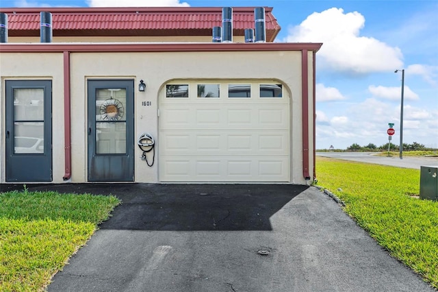 1601 N Ocean Shore Blvd, Flagler Beach, FL 32136 - garage with asphalt driveway