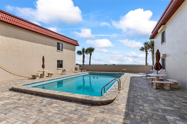 1601 N Ocean Shore Blvd, Flagler Beach, FL 32136 - community pool featuring a patio