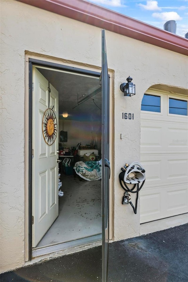 1601 N Ocean Shore Blvd, Flagler Beach, FL 32136 - doorway to property featuring stucco siding