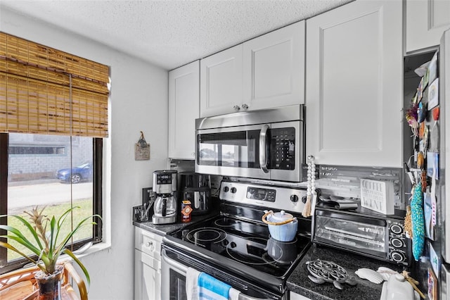 1601 N Ocean Shore Blvd, Flagler Beach, FL 32136 - kitchen with appliances with stainless steel finishes, white cabinets, backsplash, and a textured ceiling