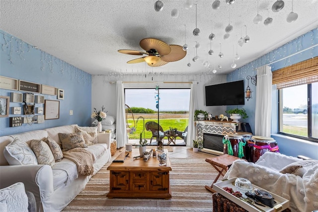 1601 N Ocean Shore Blvd, Flagler Beach, FL 32136 - living area featuring ceiling fan and a textured ceiling