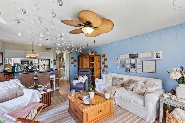 1601 N Ocean Shore Blvd, Flagler Beach, FL 32136 - tiled living area featuring a textured ceiling and a ceiling fan