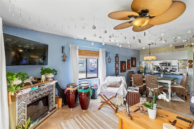 1601 N Ocean Shore Blvd, Flagler Beach, FL 32136 - living room featuring tile patterned flooring and a ceiling fan