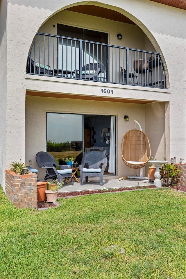1601 N Ocean Shore Blvd, Flagler Beach, FL 32136 - back of house featuring a balcony and stucco siding