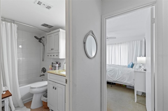 1601 N Ocean Shore Blvd, Flagler Beach, FL 32136 - ensuite bathroom featuring shower / bath combo with shower curtain, vanity, and toilet