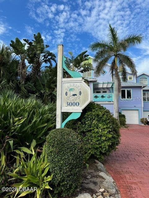 3000 Ocean Shore Blvd Unit 150, Ormond Beach, FL 32176 - community sign featuring a garage and decorative driveway