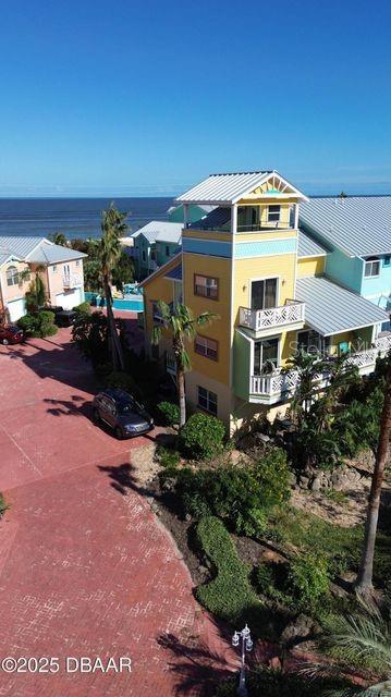 3000 Ocean Shore Blvd Unit 150, Ormond Beach, FL 32176 - exterior space with metal roof and a balcony
