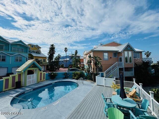 3000 Ocean Shore Blvd Unit 150, Ormond Beach, FL 32176 - view of pool featuring a wooden deck, a fenced in pool, fence, and a residential view