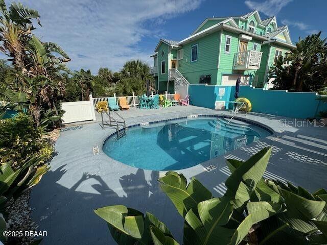 3000 Ocean Shore Blvd Unit 150, Ormond Beach, FL 32176 - pool featuring fence and a patio area