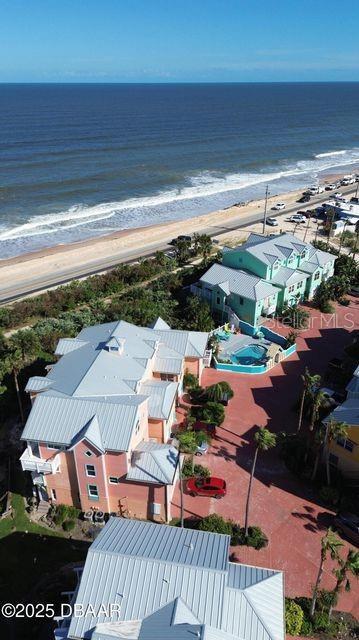 3000 Ocean Shore Blvd Unit 150, Ormond Beach, FL 32176 - aerial view featuring a water view and a beach view